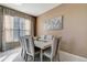 Elegant dining room featuring modern chairs, tiled floor and natural lighting at 1453 Appleton Pl, Wesley Chapel, FL 33543