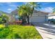 Charming single-story home with well-manicured lawn, beautiful landscaping and large driveway at 1453 Appleton Pl, Wesley Chapel, FL 33543