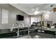 Breakfast bar overlooking the living room with a breakfast bar and view of the fireplace at 1453 Appleton Pl, Wesley Chapel, FL 33543