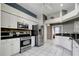 Spacious kitchen featuring stainless steel appliances and white cabinetry at 1453 Appleton Pl, Wesley Chapel, FL 33543