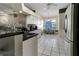 Large kitchen with stainless steel appliances, granite countertops, and adjacent dining area at 1453 Appleton Pl, Wesley Chapel, FL 33543
