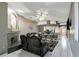 Spacious living room with fireplace, seating, and open view of the kitchen area at 1453 Appleton Pl, Wesley Chapel, FL 33543