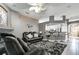 Open-concept living room with bar seating and modern finishes at 1453 Appleton Pl, Wesley Chapel, FL 33543