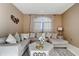 Comfortable living room featuring a large sectional sofa and neutral decor at 1453 Appleton Pl, Wesley Chapel, FL 33543