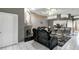 Open-concept living area with modern finishes, fireplace, and a breakfast bar at 1453 Appleton Pl, Wesley Chapel, FL 33543