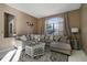 Spacious living room with a large sectional couch, decorative coffee table, and natural light at 1453 Appleton Pl, Wesley Chapel, FL 33543