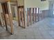 Renovation of a living room showcasing stud walls, tile floor, and electrical wiring at 16217 Redington Dr, Redington Beach, FL 33708