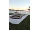 Beautiful pool and sunset overlooking a serene waterfront and dock at 16217 Redington Dr, Redington Beach, FL 33708