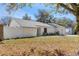 Well-maintained home with a white fence, neutral palette, and clean landscape at 17607 Cranbrook Dr, Lutz, FL 33549