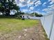 Large backyard with a white fence providing privacy, perfect for outdoor activities and relaxation at 1811 Tawnee Pl, Brandon, FL 33510