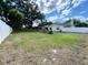 Expansive backyard with green grass and a white fence, perfect for outdoor activities and privacy at 1811 Tawnee Pl, Brandon, FL 33510