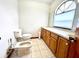 Bright bathroom features tile floors and vanity at 1811 Tawnee Pl, Brandon, FL 33510