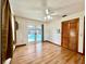 Bedroom overlooking pool with hardwood flooring and closet space at 1811 Tawnee Pl, Brandon, FL 33510
