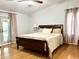 Comfortable bedroom with nice bed and hardwood floors and natural light at 1811 Tawnee Pl, Brandon, FL 33510