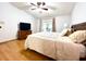 Spacious bedroom with vaulted ceiling, hardwood floors, and exterior access at 1811 Tawnee Pl, Brandon, FL 33510