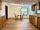 Bright dining area with wood cabinetry and flooring at 1811 Tawnee Pl, Brandon, FL 33510