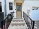 Inviting front entrance with decorative glass door, tiled steps, and black metal railings for a touch of elegance and safety at 1811 Tawnee Pl, Brandon, FL 33510