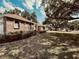 Well-maintained front yard with lush greenery and a paved pathway leading to the home's entrance at 1811 Tawnee Pl, Brandon, FL 33510