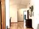 Hallway with vaulted ceilings and wood look floors at 1811 Tawnee Pl, Brandon, FL 33510