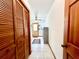 Hallway with wood doors, and access to the kitchen at 1811 Tawnee Pl, Brandon, FL 33510