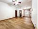 Bright living room with wood-look floors, neutral walls, and ample natural light creates a cozy atmosphere at 1811 Tawnee Pl, Brandon, FL 33510