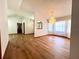 Spacious living room featuring wood floors and large windows providing ample natural light at 1811 Tawnee Pl, Brandon, FL 33510