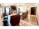 This living room features a brick fireplace, ceiling fan, and tiled floors at 1811 Tawnee Pl, Brandon, FL 33510