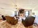Living room boasts a brick fireplace, ceiling fan, and tile flooring at 1811 Tawnee Pl, Brandon, FL 33510