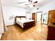 Comfortable main bedroom featuring hardwood floors, a ceiling fan, and a neutral color scheme at 1811 Tawnee Pl, Brandon, FL 33510