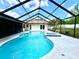 Beautiful pool with adjacent spa, framed by a screened enclosure and backyard views at 1811 Tawnee Pl, Brandon, FL 33510