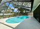 In-ground pool with hot tub and enclosure offering an ideal outdoor entertainment space at 1811 Tawnee Pl, Brandon, FL 33510