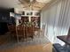 A dining room featuring a rustic wooden table and chairs, complemented by built-in shelving at 214 45Th Ne Ave, St Petersburg, FL 33703