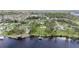 Aerial view showcasing property lines with a dock and canal access, promising serene waterfront living at 2307 7Th Sw St, Ruskin, FL 33570