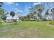 Expansive backyard with mature trees and landscaping at 2307 7Th Sw St, Ruskin, FL 33570