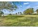 Expansive backyard with mature trees and access to the water at 2307 7Th Sw St, Ruskin, FL 33570