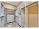 A walk-in closet has shelves and drawers for maximum storage at 2307 7Th Sw St, Ruskin, FL 33570