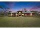 Stunning front exterior elevation with a landscaped yard and a grand double-door entrance at 2307 7Th Sw St, Ruskin, FL 33570