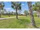 Long private driveway with mature trees and lush landscaping, set on a sprawling lot, offering peace and privacy at 2307 7Th Sw St, Ruskin, FL 33570