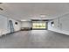 Large garage interior with black rubber flooring and windows at 2307 7Th Sw St, Ruskin, FL 33570