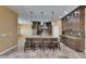 Modern kitchen island featuring pendant lights, seating, and stainless steel appliances at 2307 7Th Sw St, Ruskin, FL 33570