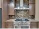Updated gourmet kitchen featuring stone backsplash and a professional stove at 2307 7Th Sw St, Ruskin, FL 33570