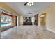 Open-concept kitchen with stone floors, an island, and a view of the pool at 2307 7Th Sw St, Ruskin, FL 33570