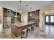 Kitchen island with seating and stainless appliances including a large refrigerator at 2307 7Th Sw St, Ruskin, FL 33570