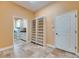 Spacious laundry room featuring tile floors, cabinets and a large shelving unit at 2307 7Th Sw St, Ruskin, FL 33570