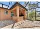 Outdoor kitchen with granite countertops, grill, stainless steel appliances, and screened-in enclosure at 2307 7Th Sw St, Ruskin, FL 33570