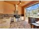 View of the outdoor kitchen featuring a bar, grill and outdoor refrigerator at 2307 7Th Sw St, Ruskin, FL 33570