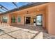 Large brick patio featuring a ceiling fan, large sliding glass doors, and outdoor furniture at 2307 7Th Sw St, Ruskin, FL 33570