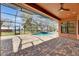 Screened in pool with brick pavers, ceiling fan and view of the river in this backyard oasis at 2307 7Th Sw St, Ruskin, FL 33570