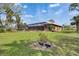 View of the rear of the home, highlighting the screened-in lanai at 2307 7Th Sw St, Ruskin, FL 33570