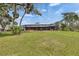 Expansive lawn with mature landscaping, and screened in lanai at 2307 7Th Sw St, Ruskin, FL 33570